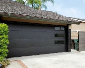Black Skyline Flush garage door with long-panel windows installed for a remodeled home in Huntington Beach, CA